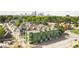 Aerial view of a modern apartment building, featuring contemporary architecture, streetscape, and city skyline backdrop at 711 E 16Th St, Indianapolis, IN 46202