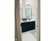 Bathroom featuring a double sink vanity with dark blue cabinets and black hardware at 711 E 16Th St, Indianapolis, IN 46202