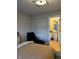 Comfortable bedroom featuring a chaise lounge and an en suite bathroom with modern finishes at 711 E 16Th St, Indianapolis, IN 46202