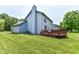 Back of house featuring a large deck, lawn, and side view of the two-story structure at 7168 Camwell Dr, Indianapolis, IN 46268