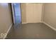 View of the basement, featuring a closet space and gray painted floor, offering potential for storage or customization at 7168 Camwell Dr, Indianapolis, IN 46268