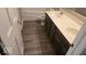 Bathroom with double vanity, stylish fixtures, and new vinyl flooring, offering a modern and updated look at 7168 Camwell Dr, Indianapolis, IN 46268