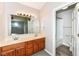 Bright bathroom with double sink vanity and updated mirror lighting at 7168 Camwell Dr, Indianapolis, IN 46268