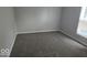 Comfortable bedroom with plush carpeting and a window, providing a relaxing and serene space at 7168 Camwell Dr, Indianapolis, IN 46268