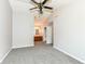 Spacious bedroom with neutral walls and carpeted floor with bathroom access at 7168 Camwell Dr, Indianapolis, IN 46268