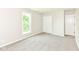 Neutral colored room with double door closet and window to the yard at 7168 Camwell Dr, Indianapolis, IN 46268