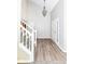 Welcoming foyer with beautiful hardwood floors, a staircase, and a chandelier at 7168 Camwell Dr, Indianapolis, IN 46268
