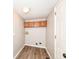 Laundry room with hard surface floors and overhead cabinet at 7168 Camwell Dr, Indianapolis, IN 46268