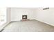 Cozy living room with brick fireplace, carpet flooring, and natural light at 7168 Camwell Dr, Indianapolis, IN 46268