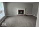 Bright living room features a fireplace, plush carpeting, and light colored walls at 7168 Camwell Dr, Indianapolis, IN 46268