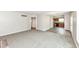 Open living room connects to kitchen with hard surface floors and natural light at 7168 Camwell Dr, Indianapolis, IN 46268