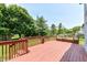Spacious wooden deck perfect for outdoor entertaining with built in seating and lush green surroundings at 7168 Camwell Dr, Indianapolis, IN 46268