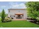 Large backyard features patio, seating, grill, and meticulous landscaping for relaxing or entertaining at 7193 Wythe Dr, Noblesville, IN 46062