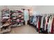 Organized closet with clothing racks, shelves, and a window for natural light at 7193 Wythe Dr, Noblesville, IN 46062
