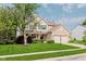 Inviting home with a manicured lawn, mature trees, and a welcoming front entrance at 7193 Wythe Dr, Noblesville, IN 46062