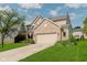 Attractive home features an attached two-car garage and a well-manicured lawn at 7193 Wythe Dr, Noblesville, IN 46062