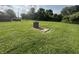 Backyard with horseshoe court and well-maintained lawn at 7346 E Buddy Ln, Camby, IN 46113