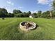 Large backyard with fire pit, shed, and plenty of room to play at 7346 E Buddy Ln, Camby, IN 46113
