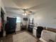 Bedroom with a ceiling fan, a small desk, and a view of the outside at 7346 E Buddy Ln, Camby, IN 46113