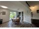 Dining area featuring wood-look floors and sliding glass doors leading to the backyard at 7346 E Buddy Ln, Camby, IN 46113