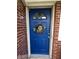 Charming front door with decorative wreath, enhancing curb appeal at 7346 E Buddy Ln, Camby, IN 46113