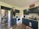Stylish kitchen with stainless steel appliances and blue cabinetry at 7346 E Buddy Ln, Camby, IN 46113