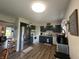 Charming kitchen with stainless steel appliances and dark blue cabinets at 7346 E Buddy Ln, Camby, IN 46113