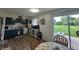 View of a kitchen featuring blue cabinets and a sliding glass door leading to a deck and spacious yard at 7346 E Buddy Ln, Camby, IN 46113