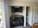 Conveniently located laundry area with storage and counter space at 7346 E Buddy Ln, Camby, IN 46113