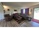 Spacious living room with a comfortable sectional sofa, offering a cozy and inviting atmosphere at 7346 E Buddy Ln, Camby, IN 46113