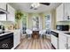 Bright breakfast nook featuring white cabinets, modern appliances, and natural light at 7743 Waterwood Dr, Indianapolis, IN 46214