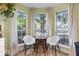 Eat-in kitchen featuring a table set for two overlooking the backyard at 7743 Waterwood Dr, Indianapolis, IN 46214