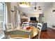 Bright dining area connecting the living room with hardwood floors and natural light at 7743 Waterwood Dr, Indianapolis, IN 46214