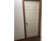 A framed door on carpet flooring gives way to a neutral wall with brown trim at 7950 Eagle Valley Pass, Indianapolis, IN 46214