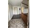 Inviting entryway with dark wood floors and half-wall divider leading into living space at 7950 Eagle Valley Pass, Indianapolis, IN 46214
