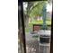 Relaxing patio area with outdoor table, chairs, umbrella, and view of the expansive backyard at 7950 Eagle Valley Pass, Indianapolis, IN 46214