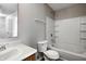 This bathroom features a vanity, toilet, and shower-tub combo with tile surround at 8030 Cork Bend Ln, Indianapolis, IN 46239