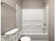 Bathroom featuring a shower/tub combo, toilet, shower head, towel rack and countertop at 8030 Cork Bend Ln, Indianapolis, IN 46239
