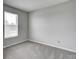Bedroom with natural light, blinds, neutral carpet, baseboards, and electrical outlets at 8030 Cork Bend Ln, Indianapolis, IN 46239