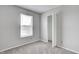 Bedroom with neutral carpet and white blinds on the window and a closet at 8030 Cork Bend Ln, Indianapolis, IN 46239
