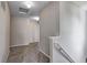 Well-lit hallway with neutral carpet, white walls and trim, and access to multiple rooms at 8030 Cork Bend Ln, Indianapolis, IN 46239