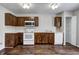 Functional kitchen with white appliances, ample storage, and wood-look floors for a stylish and practical space at 8030 Cork Bend Ln, Indianapolis, IN 46239