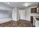 Well-lit kitchen flowing to living space featuring modern appliances, and plenty of cabinet space at 8030 Cork Bend Ln, Indianapolis, IN 46239