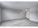 Spacious living room boasts neutral tones, offering a versatile space with ample natural light and fresh carpet at 8030 Cork Bend Ln, Indianapolis, IN 46239