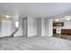 Inviting living space connects to the kitchen, showcasing a modern open-concept layout, fresh paint and new carpet at 8030 Cork Bend Ln, Indianapolis, IN 46239