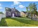 View of the rear of a two-story home with a grassy lawn at 808 N Layman Ave, Indianapolis, IN 46219