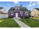View of the rear of a two-story home with grassy lawn at 808 N Layman Ave, Indianapolis, IN 46219