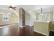 Open bonus room with hardwood floors, exposed brick, and bright lighting at 808 N Layman Ave, Indianapolis, IN 46219