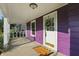View of the covered front porch with a welcoming door and stylish accents at 808 N Layman Ave, Indianapolis, IN 46219