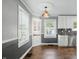 Bright kitchen with white cabinetry, stainless steel appliances, and granite countertops at 808 N Layman Ave, Indianapolis, IN 46219